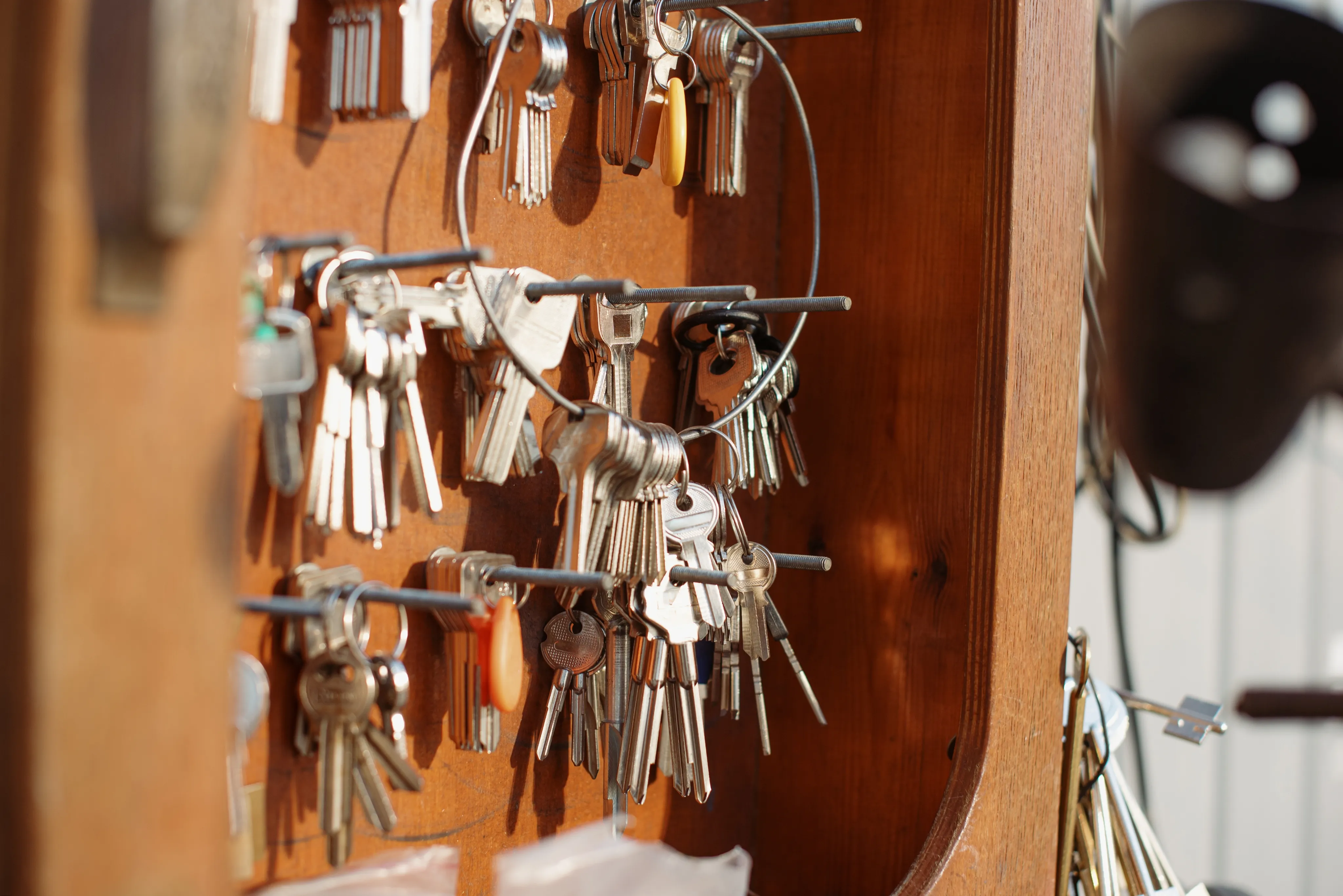 Wall of cut keys hanging on hooks
