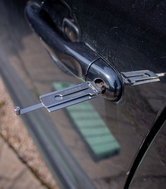 Locksmith holding a set of car and house keys