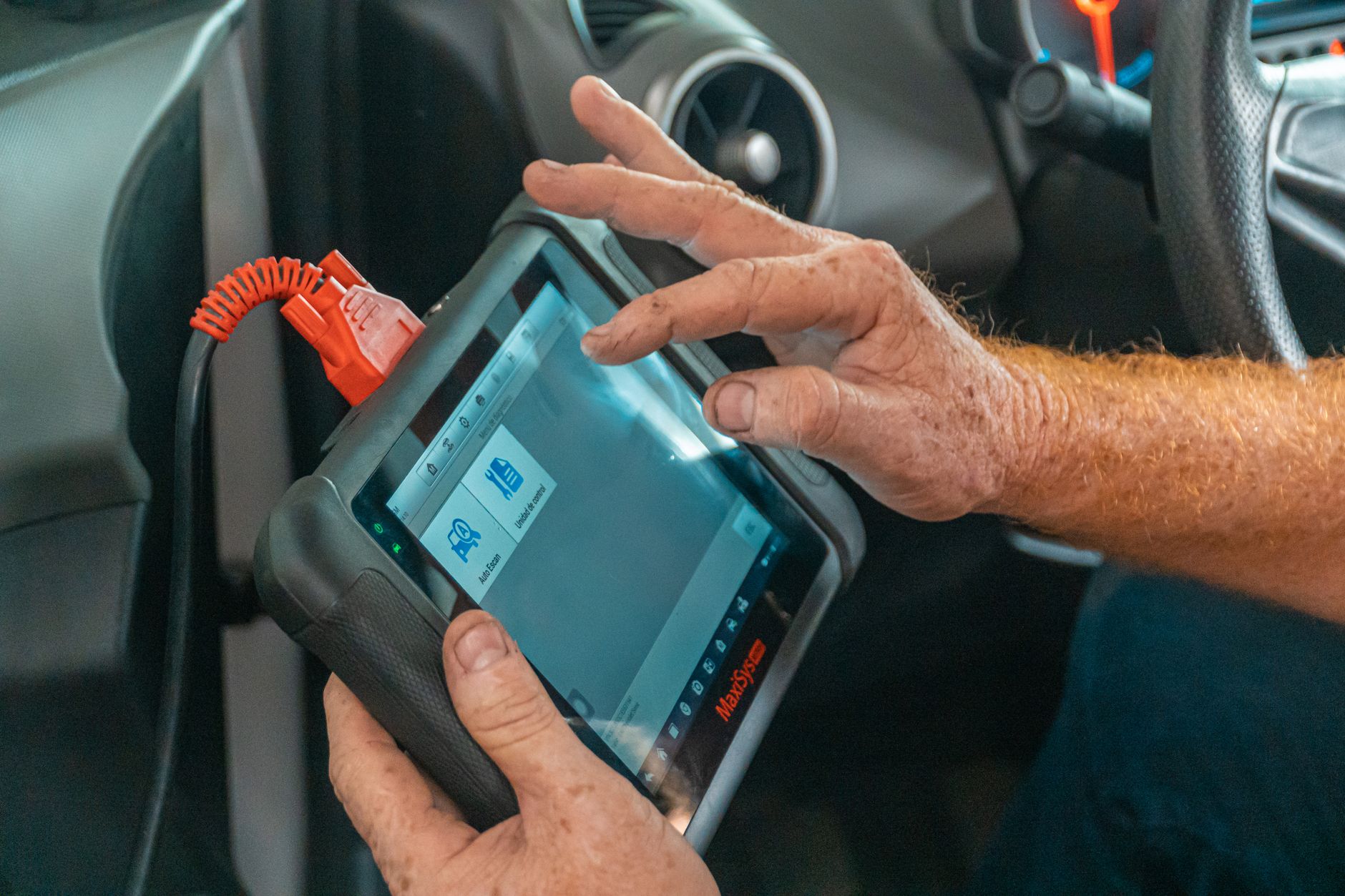 Technician programming a car key fob