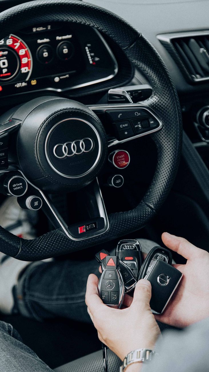 Locksmith handing over a car key