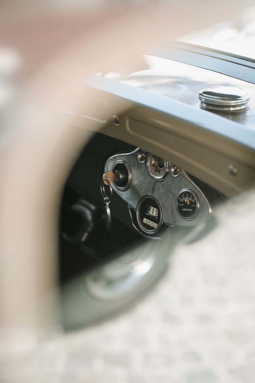 Key in the ignition of a classic car dashboard